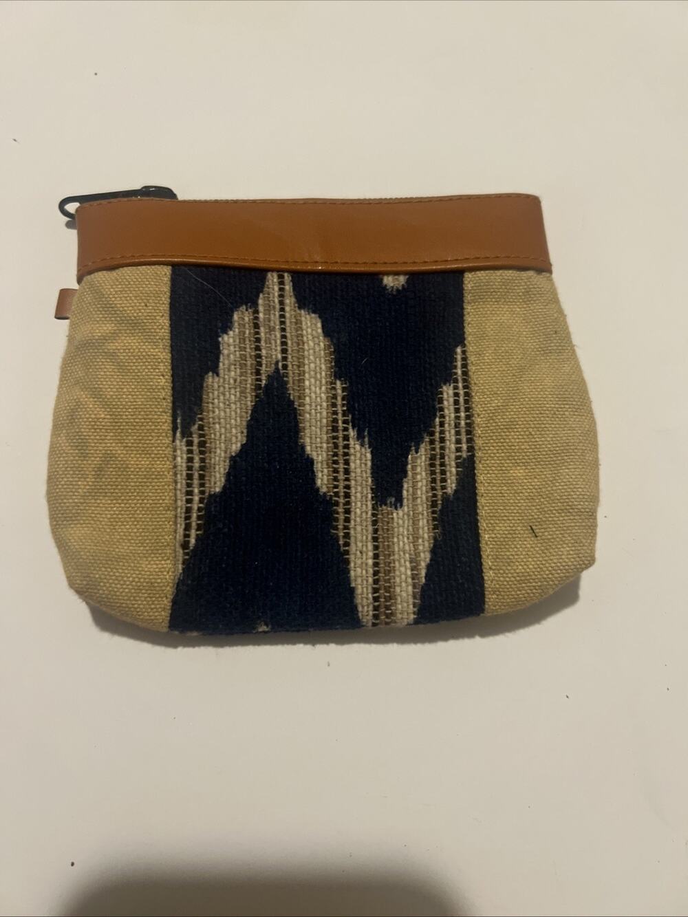small leather pouch shown in the image is Midnight Sun